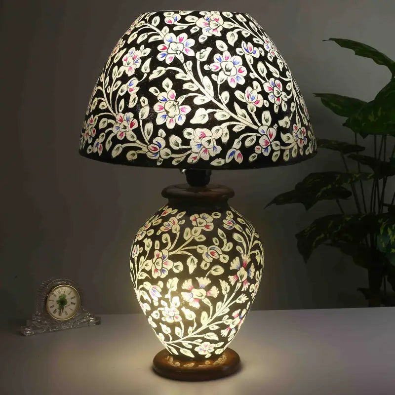 “Unique handpainted camel skin lamp with intricate artisan patterns and warm glow on pine wood base – traditional handmade decor”