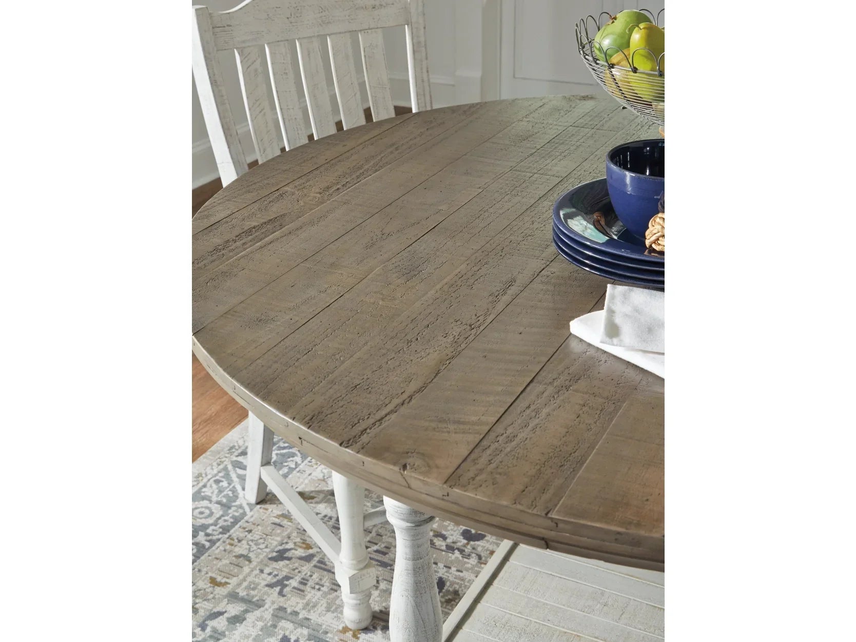 Wooden dining table with chairs in a room setting