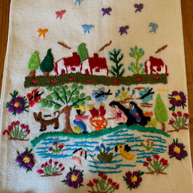Embroidered scene with people by a lake, animals, and nature elements on a beige background Style A
