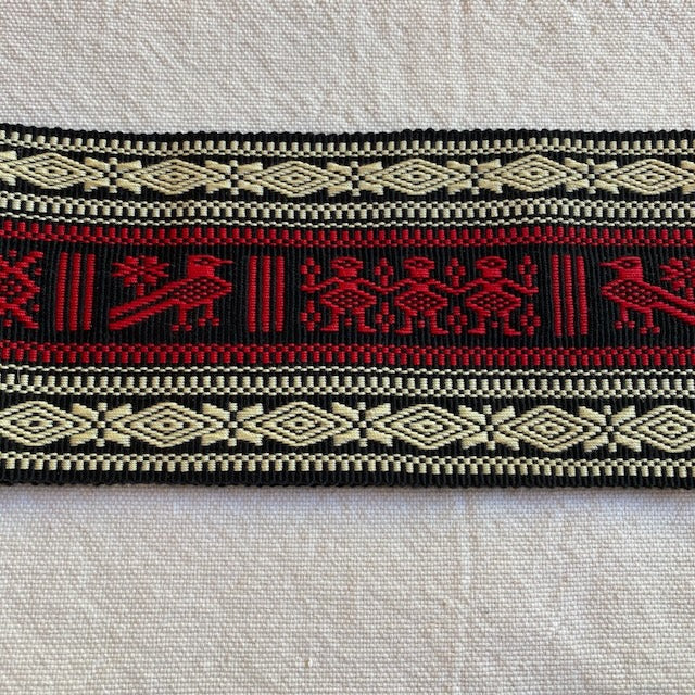 Decorative belt with red, black, and beige patterns on a light background Authentic large woven faja from Cuanajo, Michoacán. Handwoven on a backstrap loom with traditional Purepecha designs. Cotton sash, 54" x 3.5" – wearable or decorative.