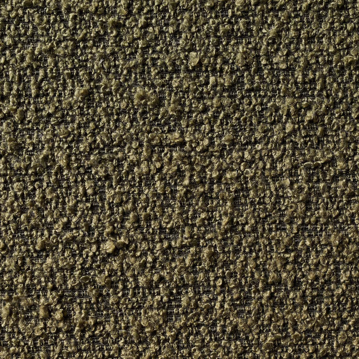 A greenish brown colored armchair with a textured fabric and square shape, placed on a light gray floor.