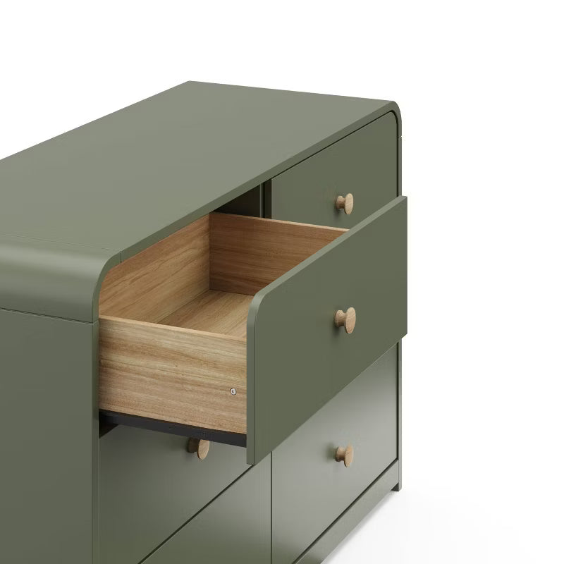 Green cabinet with an open drawer on a white background