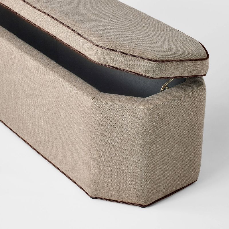 Brown linen storage bench with hinged lid open showing interior space