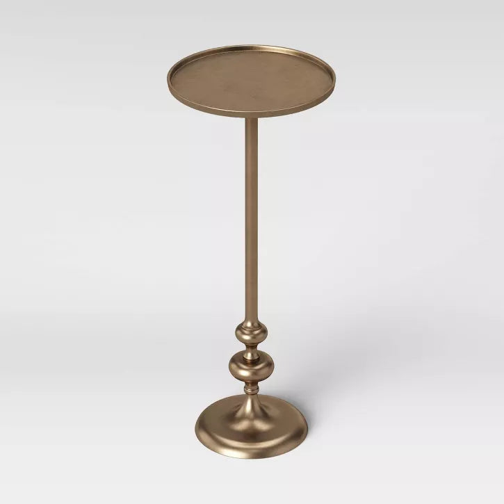 Brass Bronze-colored pedestal table on a white background