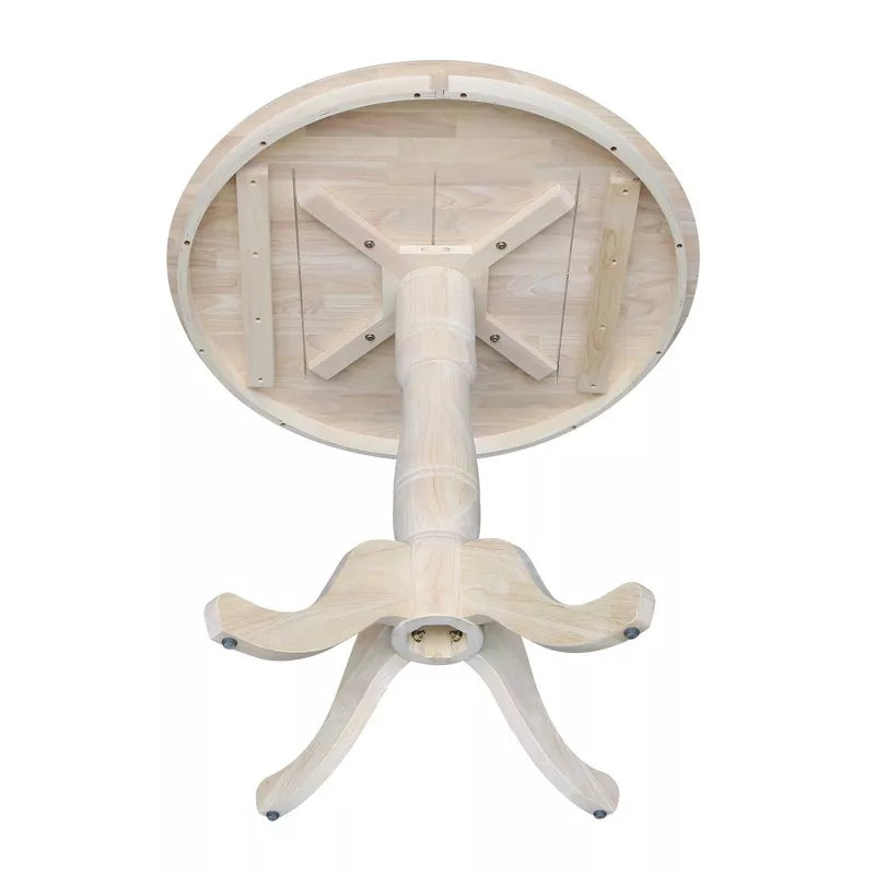 Wooden pedestal table base on a white background