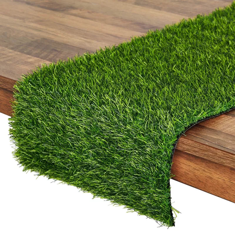 Artificial grass mat on a wooden floor