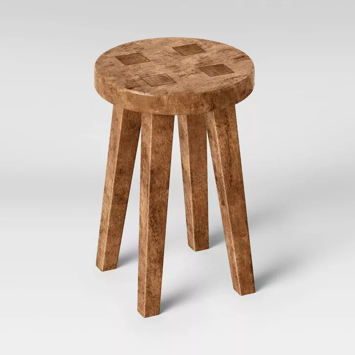 Short Wooden stool with a checkered pattern on a white background