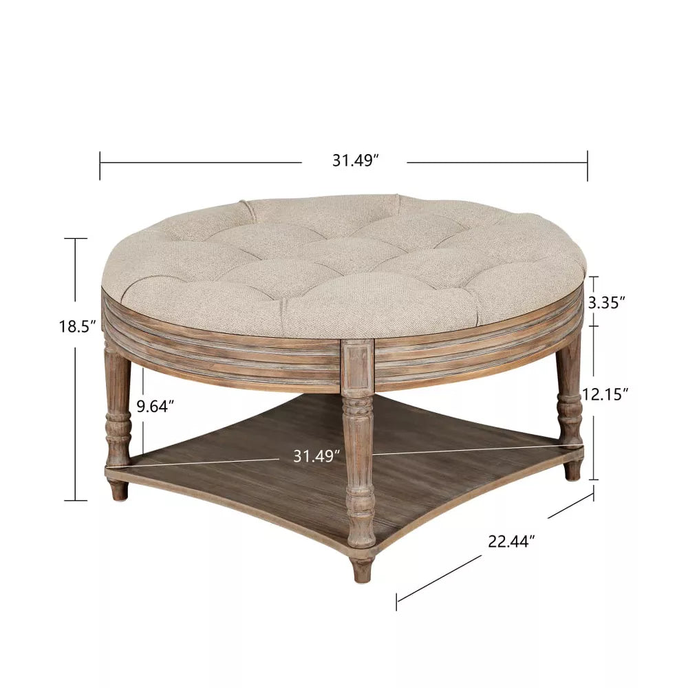 Round wooden coffee table with a tray of drinks in a living room setting.khaki
