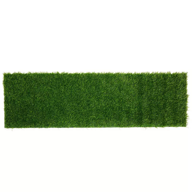 Rectangular piece of artificial grass on a white background