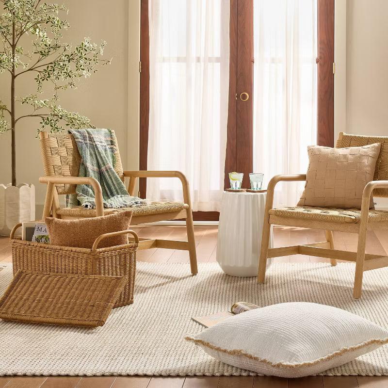 Textured fabric blanket with frayed edges on a green background Sour Cream