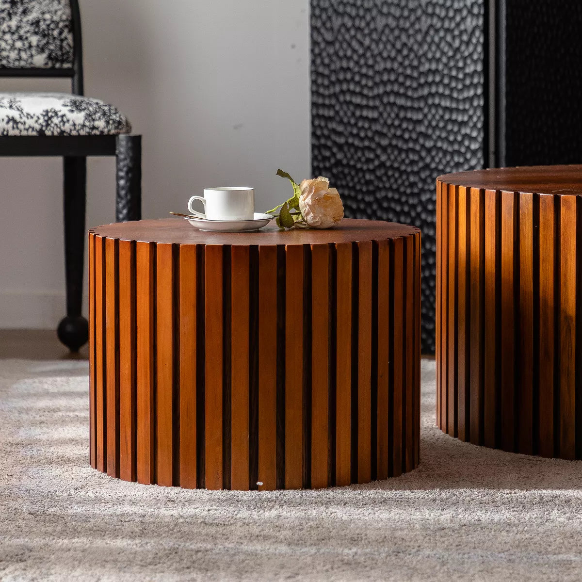 Two wooden side tables with a striped pattern on a white background