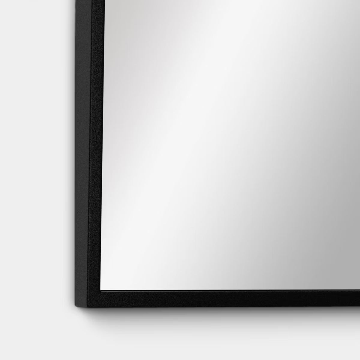 Rectangular mirror with a black colored frame.