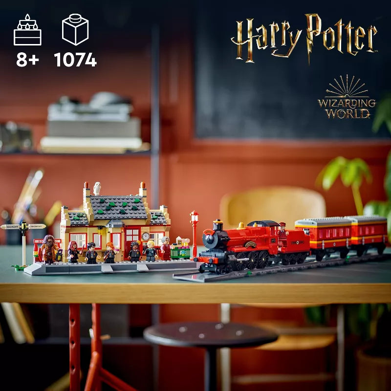 Harry Potter-themed toy train set on a table with 'Wizarding World' branding.