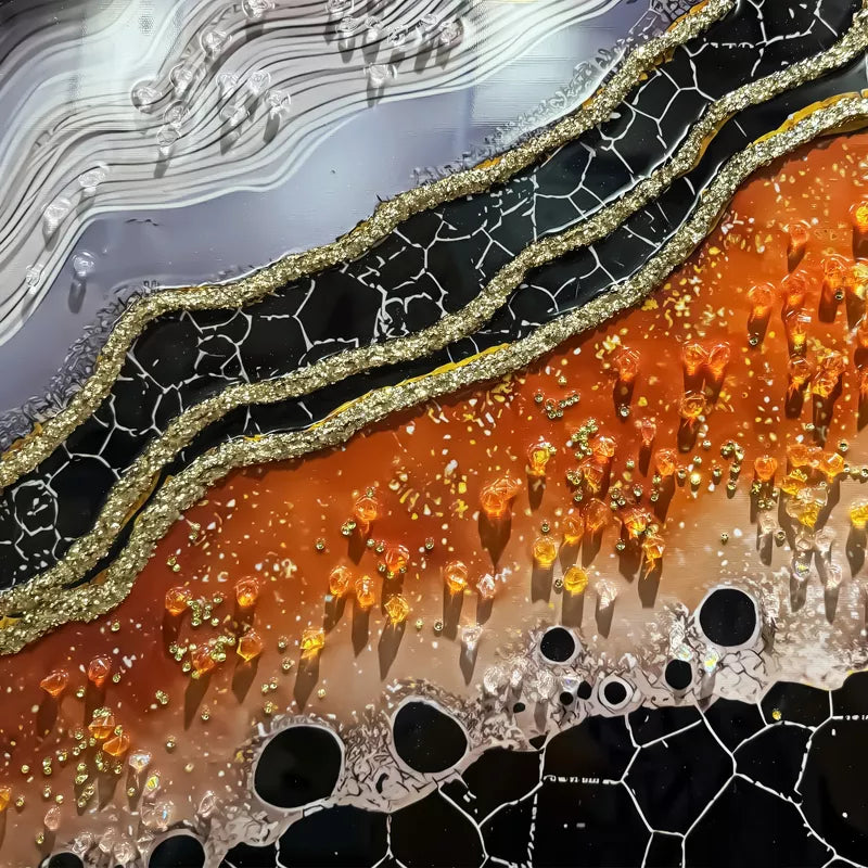 Close-up of a textured surface with black, orange, and gray colors