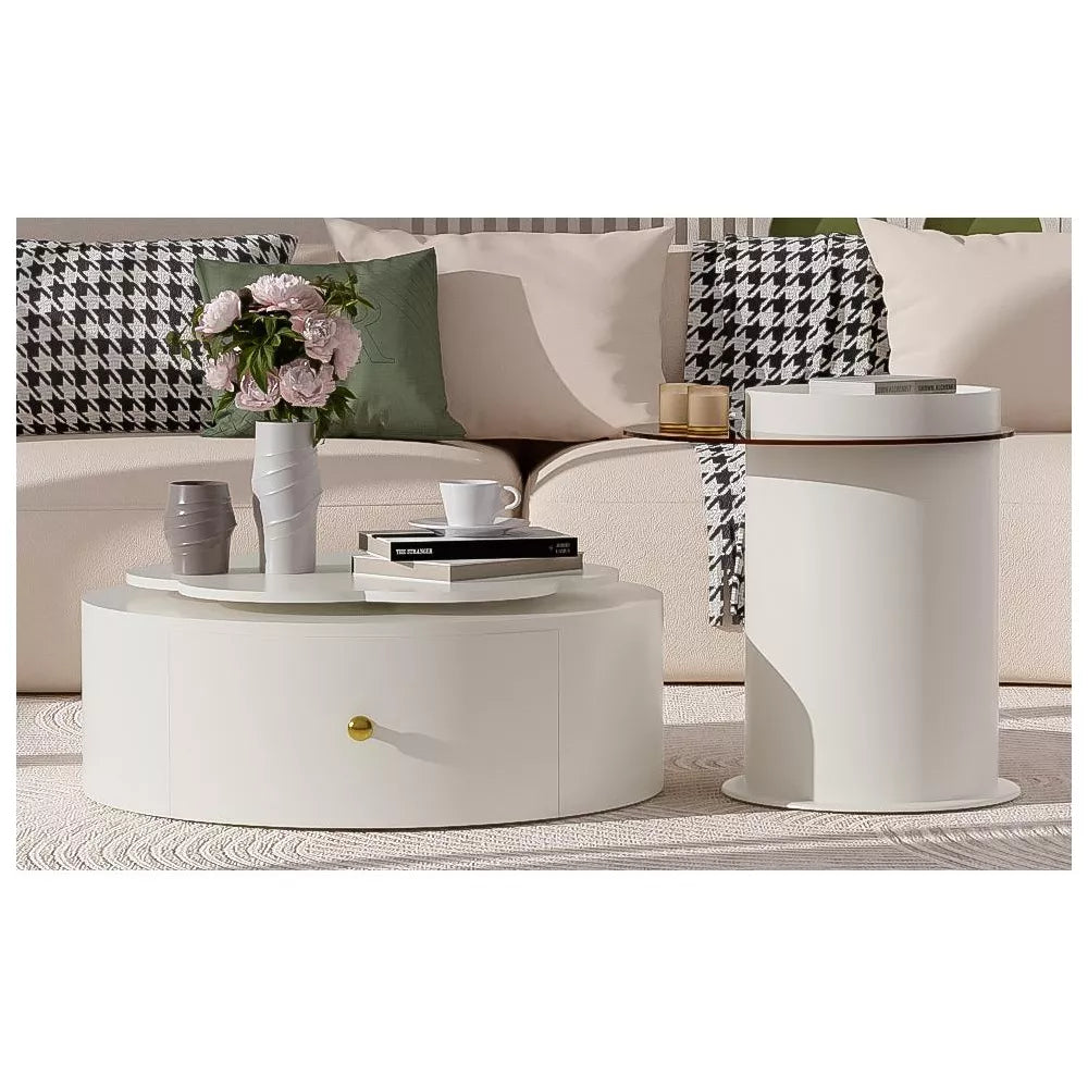 Round coffee table with decorative items in a living room setting