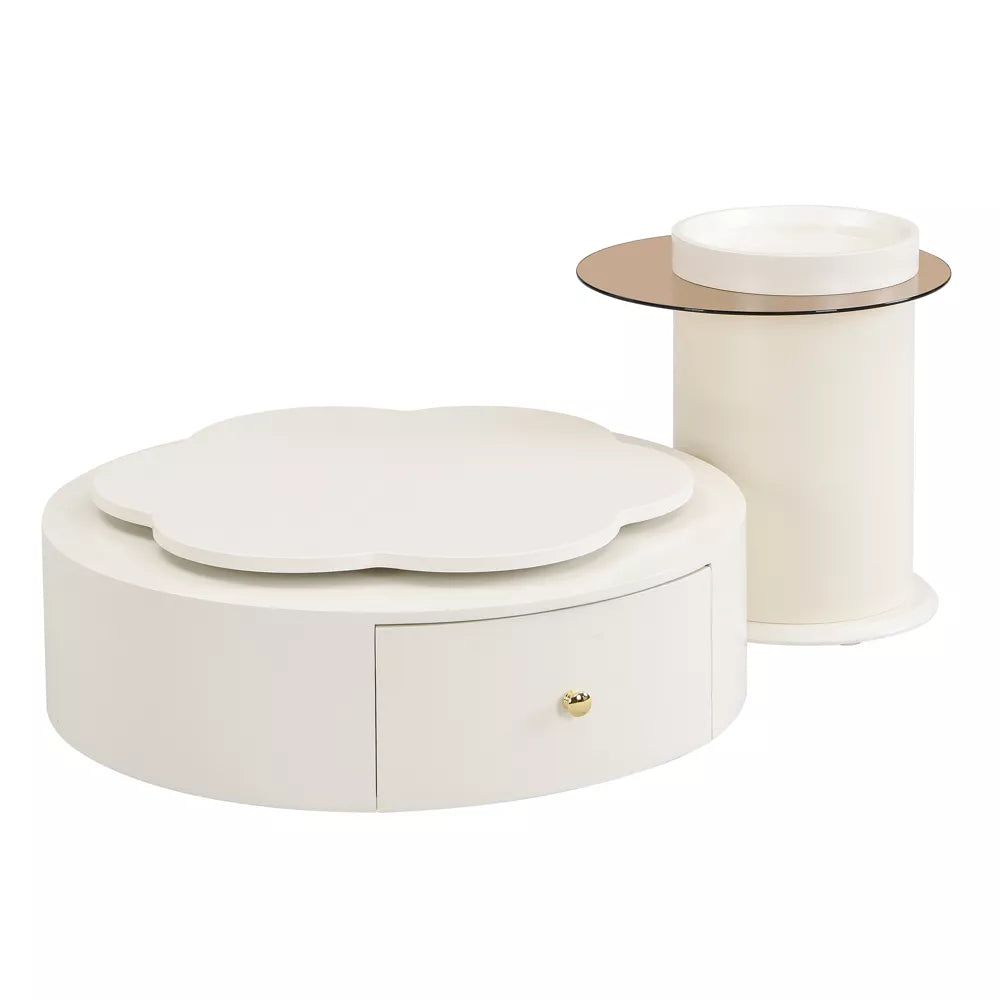 Round coffee table with decorative items in a living room setting