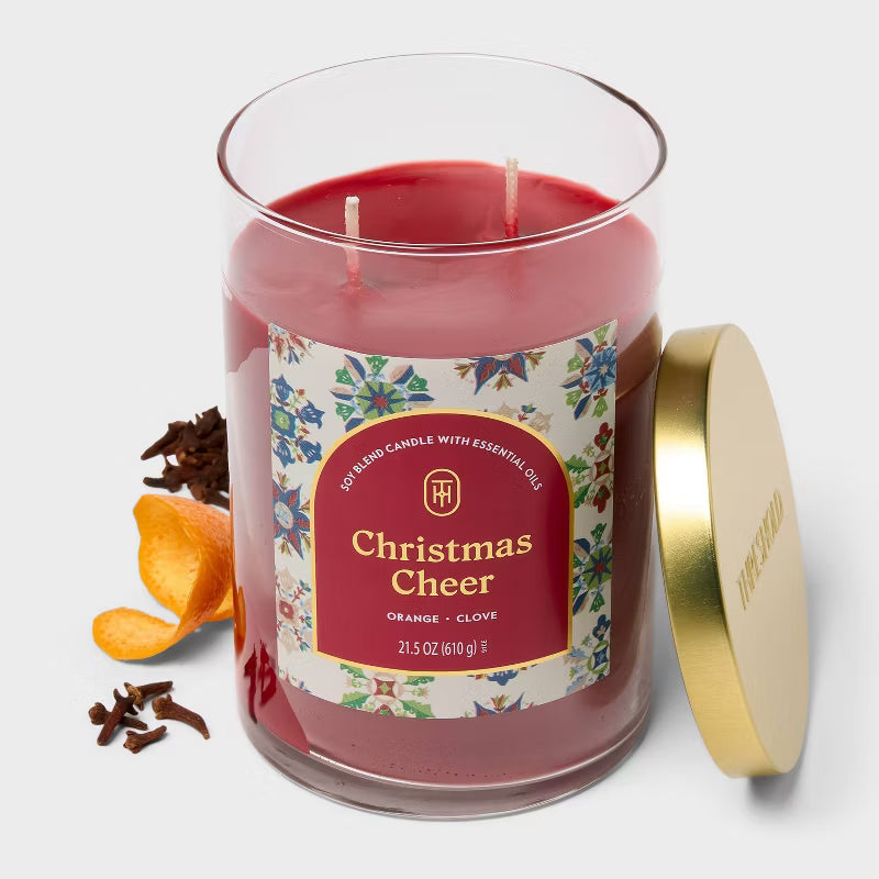 Candle with 'Christmas Cheer' label on a white background 21.5oz