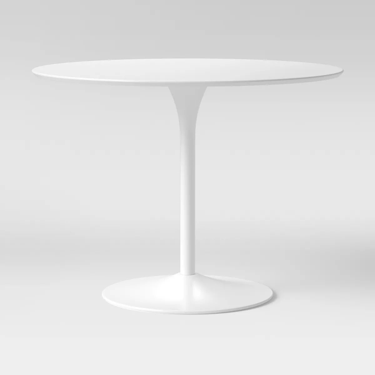 White pedestal table on a light gray background