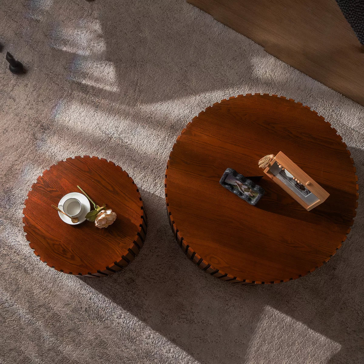 Two wooden side tables with a striped pattern on a white background