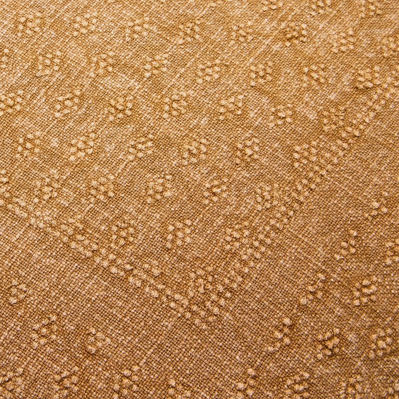 Brown textured pillow with a zipper on a light gray background Natural