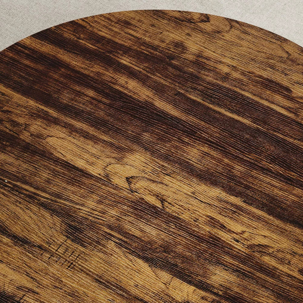 Wooden coffee table with black metal legs in a living room setting.brown