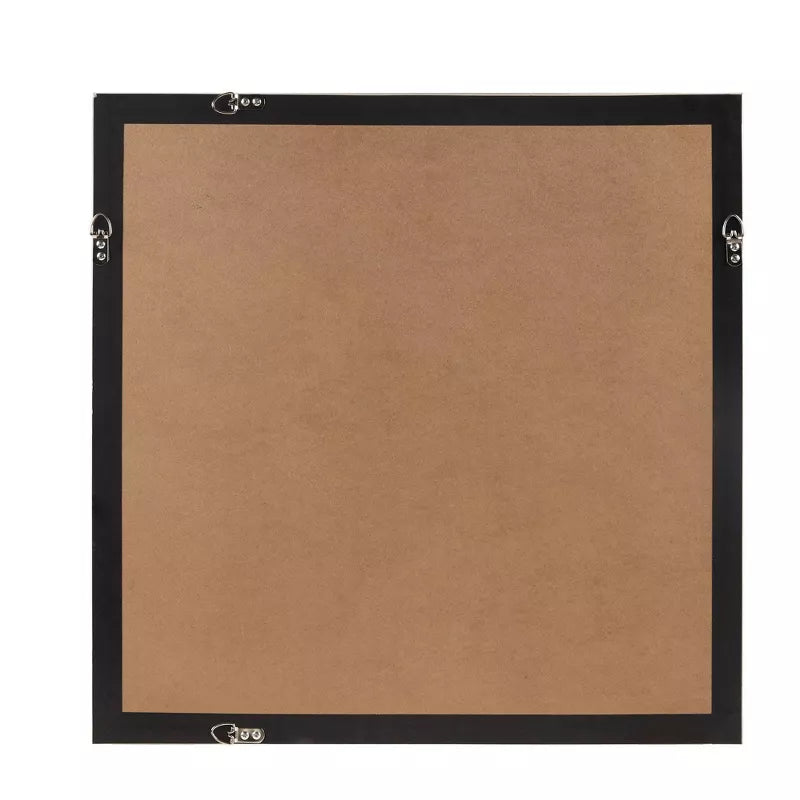 Bullseye cork bulletin board with black frame on a white background