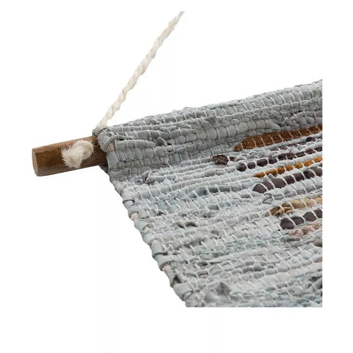 Textured wall hanging with a pattern of horizontal stripes on a white background