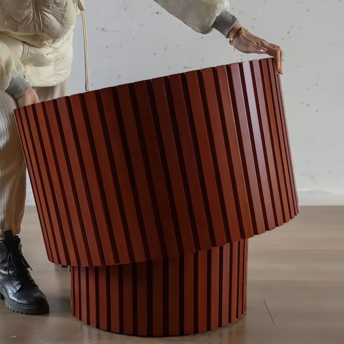 Two wooden side tables with a striped pattern on a white background