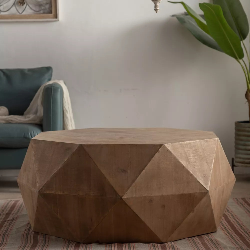 Hexagonal wooden coffee table with a cup, saucer, and flowers on a wooden floor.