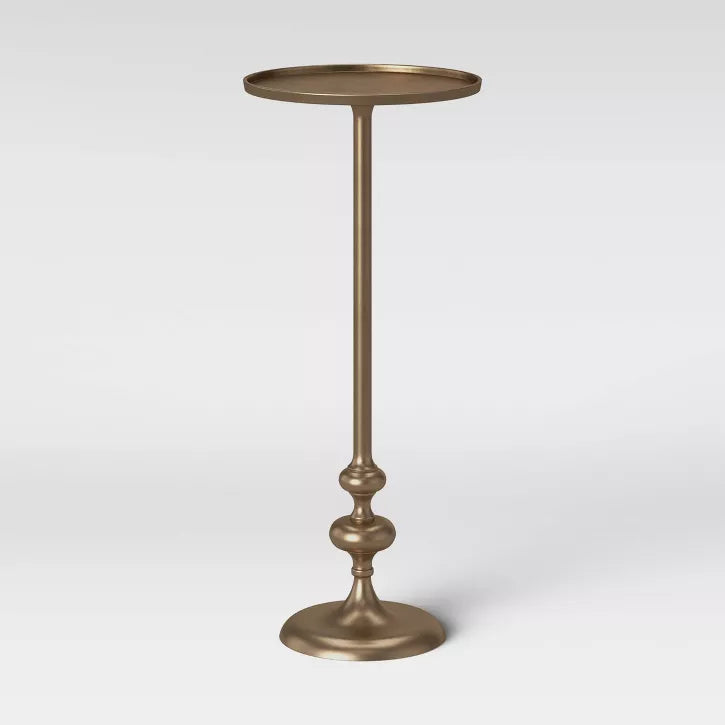 Brass Bronze-colored pedestal table on a white background