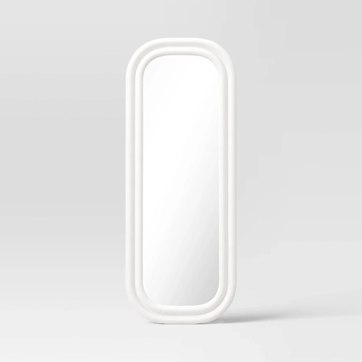 A white colored mirror with a rounded rectangular frame against a light gray background.