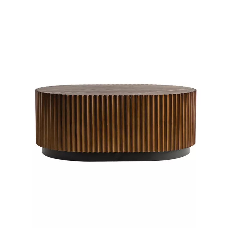 Wooden coffee table with a textured surface, featuring a book and flowers on top.