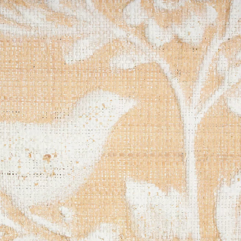 Close-up of a textured fabric with a floral pattern in beige and white.