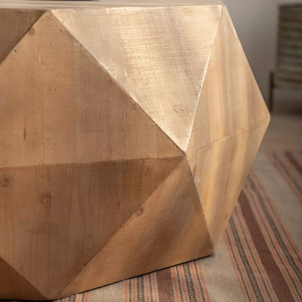 Hexagonal wooden coffee table with a cup, saucer, and flowers on a wooden floor.