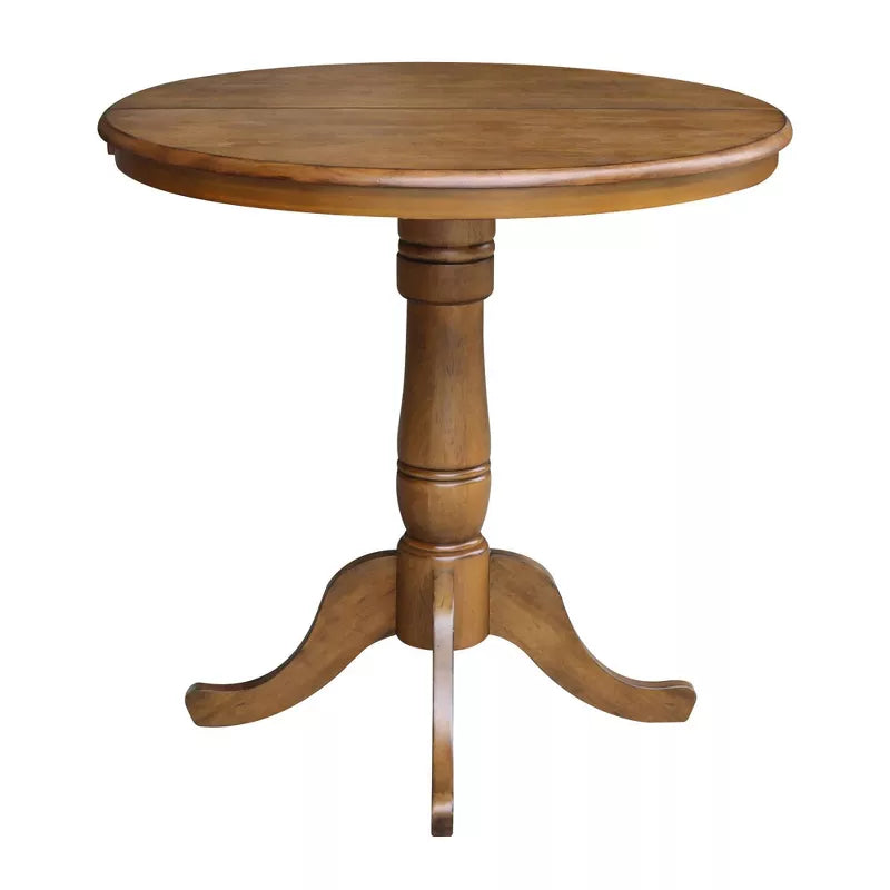 Wooden round table with a pedestal base on a white background