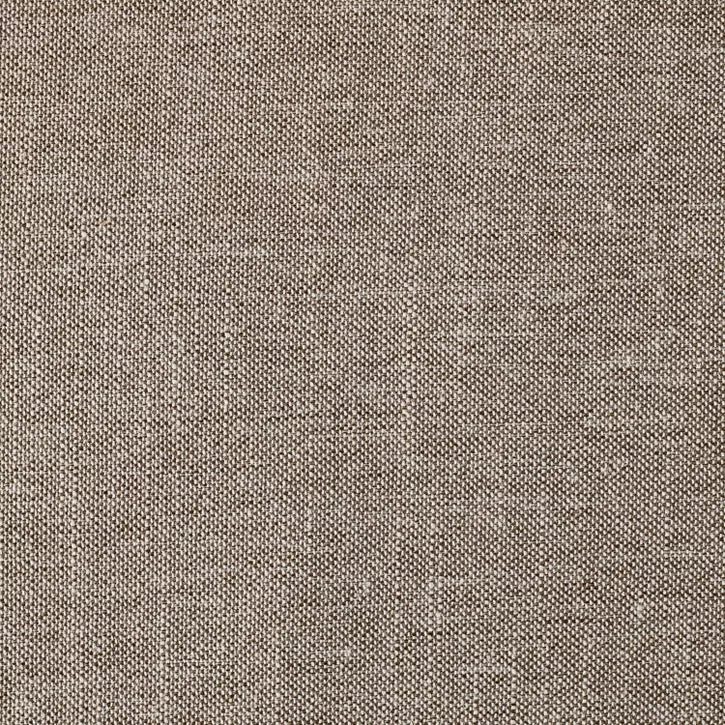 Hexagonal light gray colored ottoman with dark trim placed on a patterned rug in a living room setting.