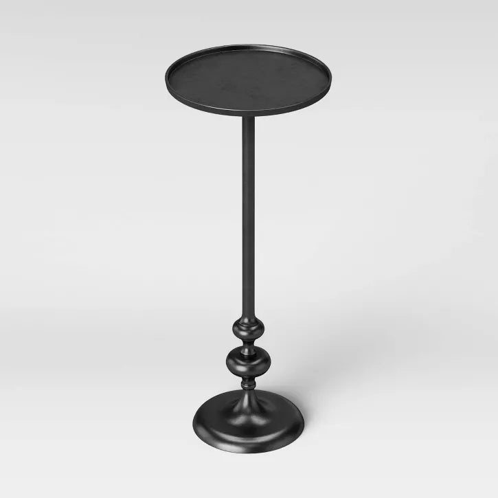 Black pedestal table on a white background