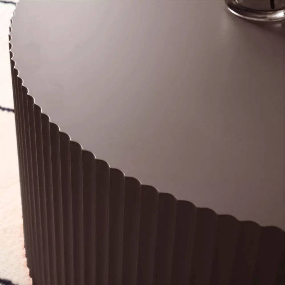 Two brown ribbed cylindrical objects on a white background brown