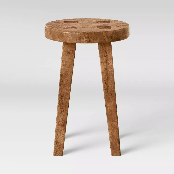 Short Wooden stool with a checkered pattern on a white background