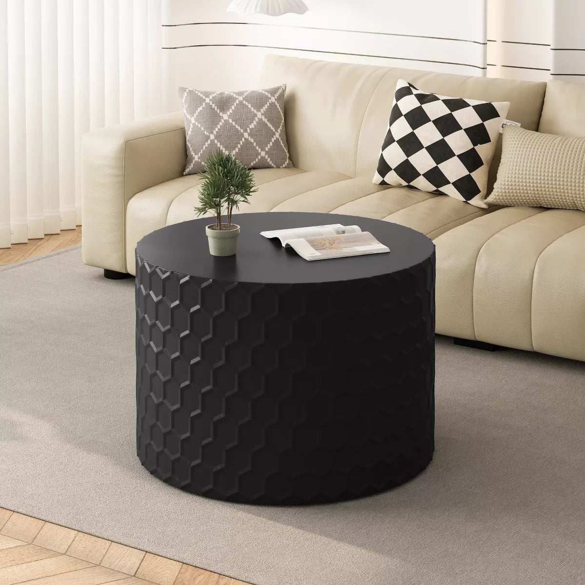 Two black textured side tables in front of a beige sofa with decorative pillows. black