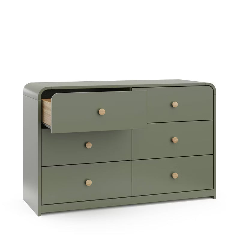 Green dresser with wooden knobs on a white background