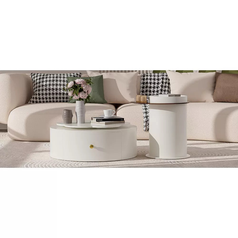 Round coffee table with decorative items in a living room setting