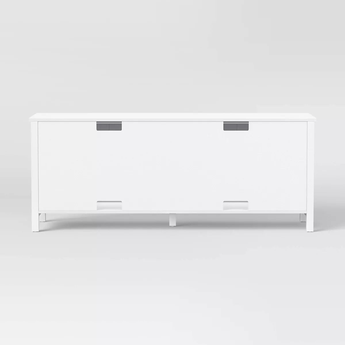 White storage cabinet with four doors on a light gray background