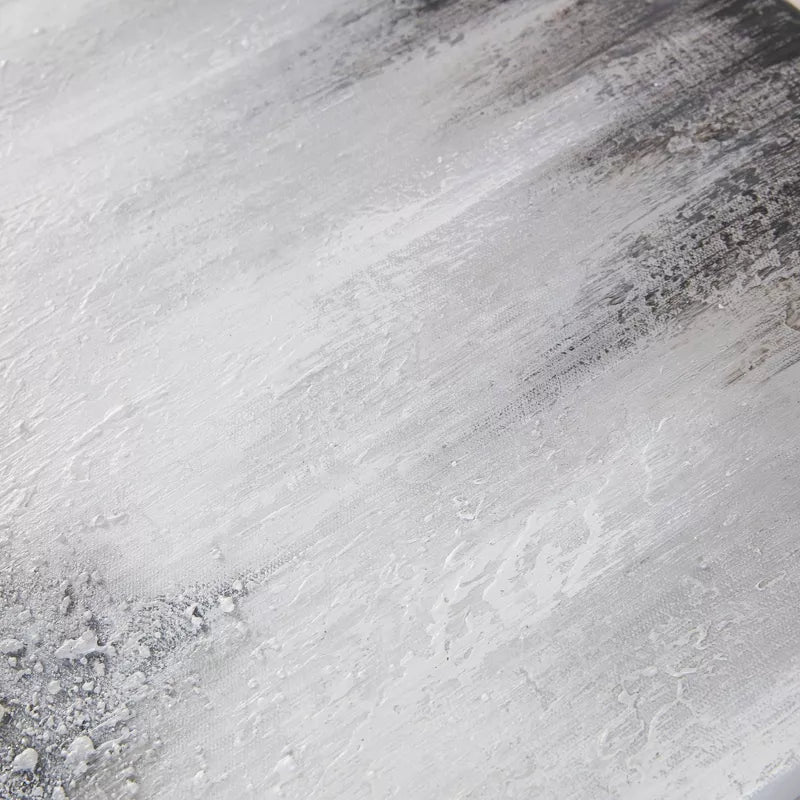 Close-up of a textured gray surface with subtle color variations
