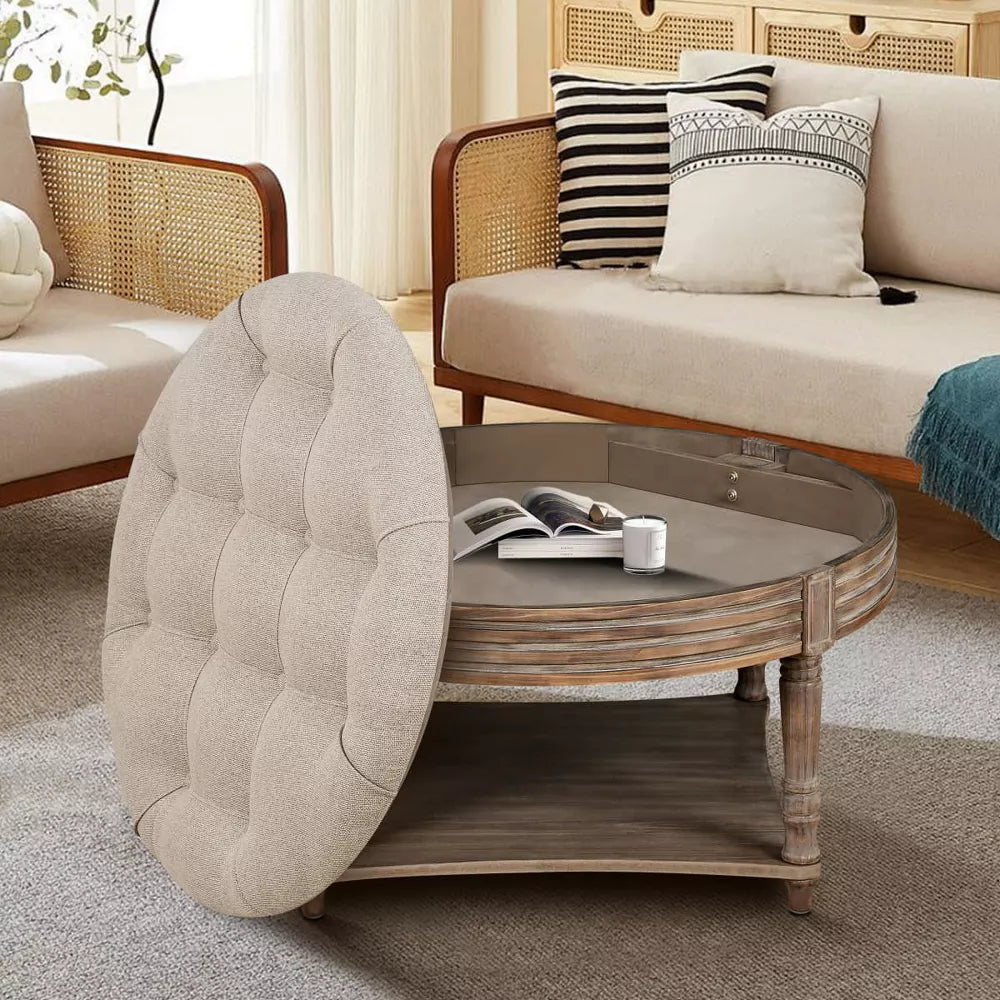 Round wooden coffee table with a tray of drinks in a living room setting.khaki