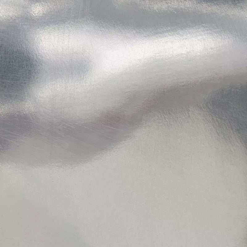 Close-up of metallic silver fabric texture