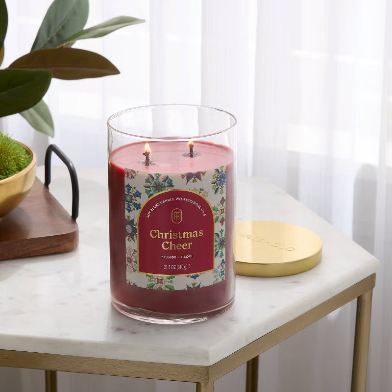 Candle with 'Christmas Cheer' label on a white background 21.5oz