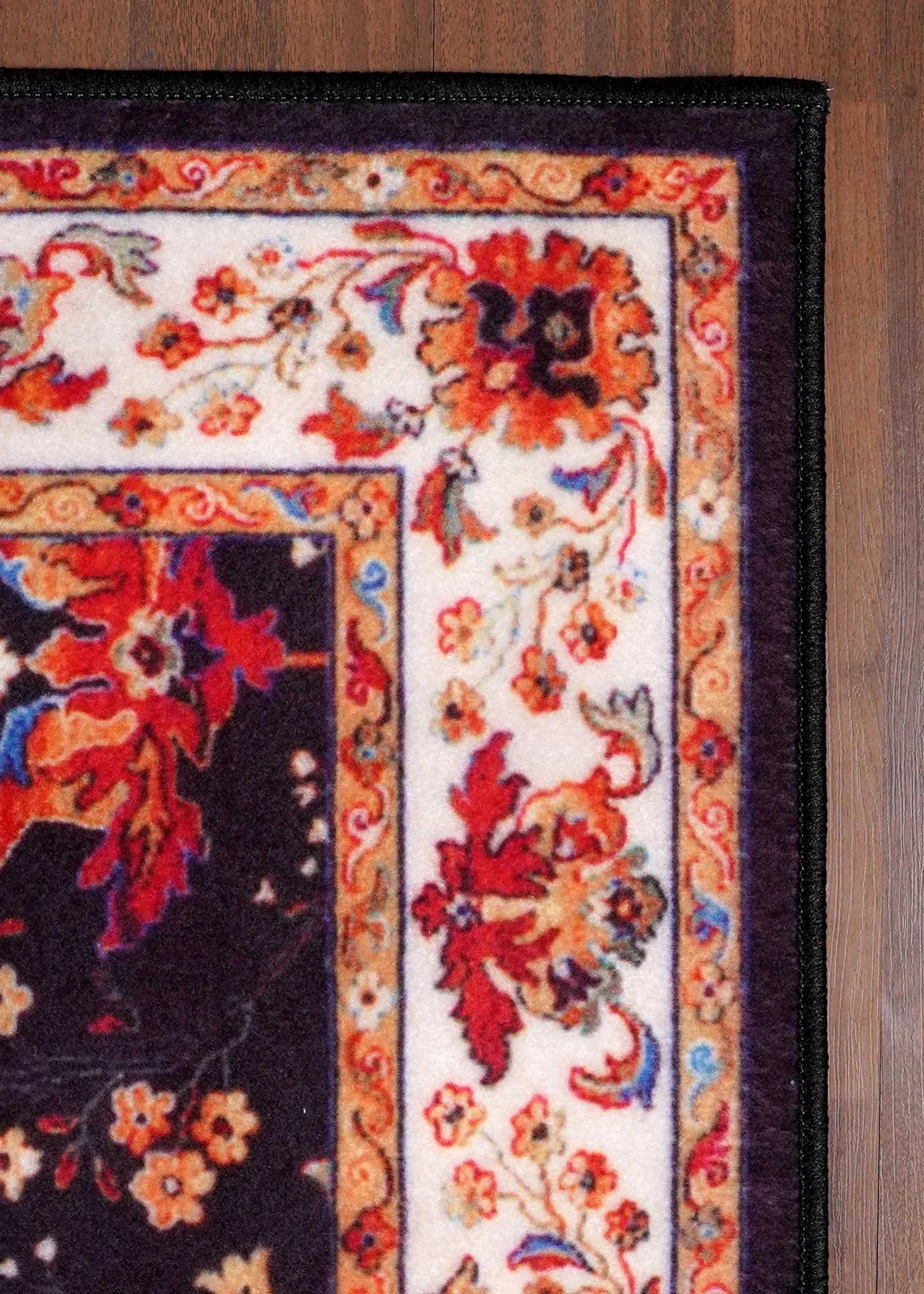 Decorative rug with floral patterns on a wooden floor