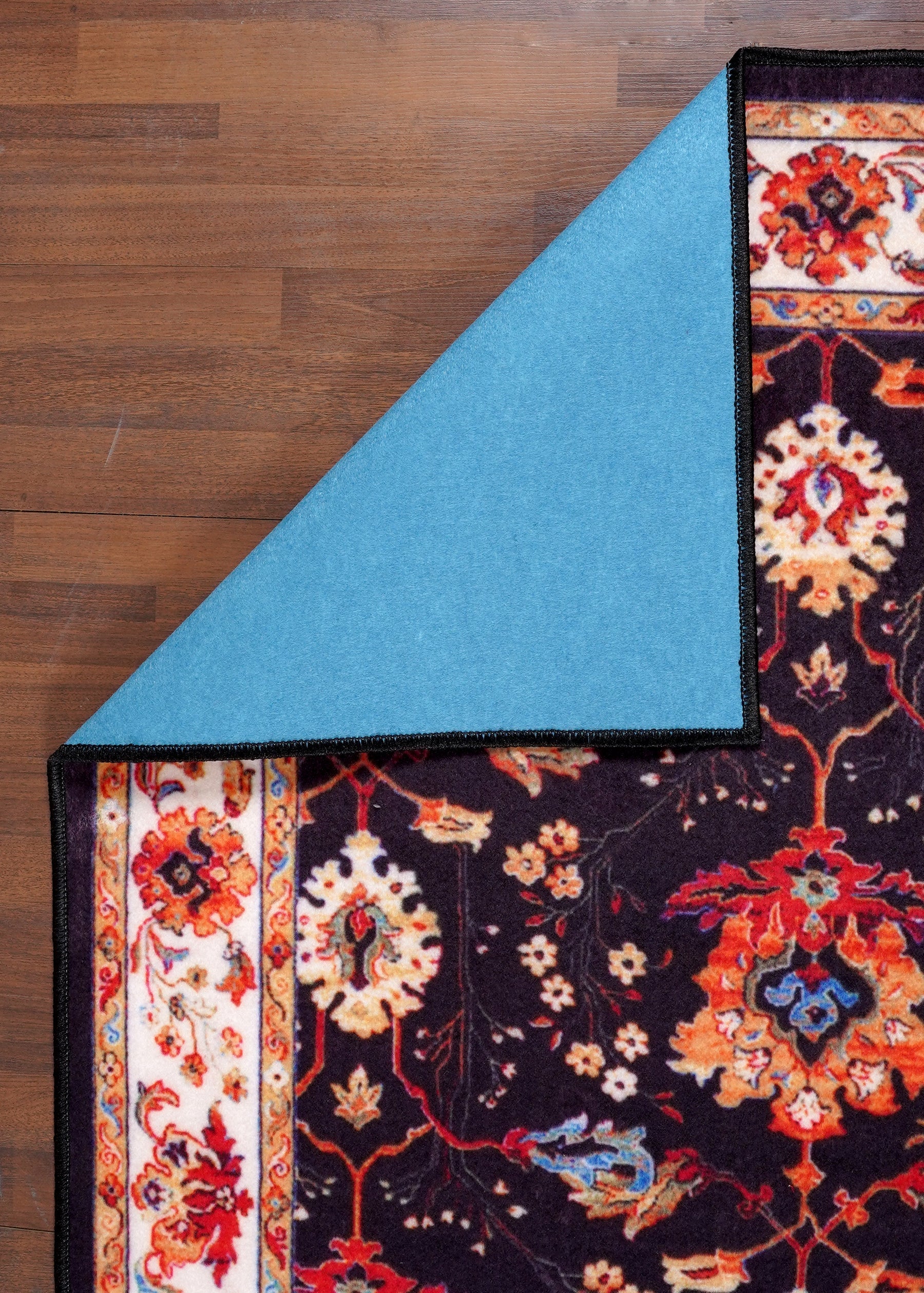 Decorative rug with floral patterns on a wooden floor