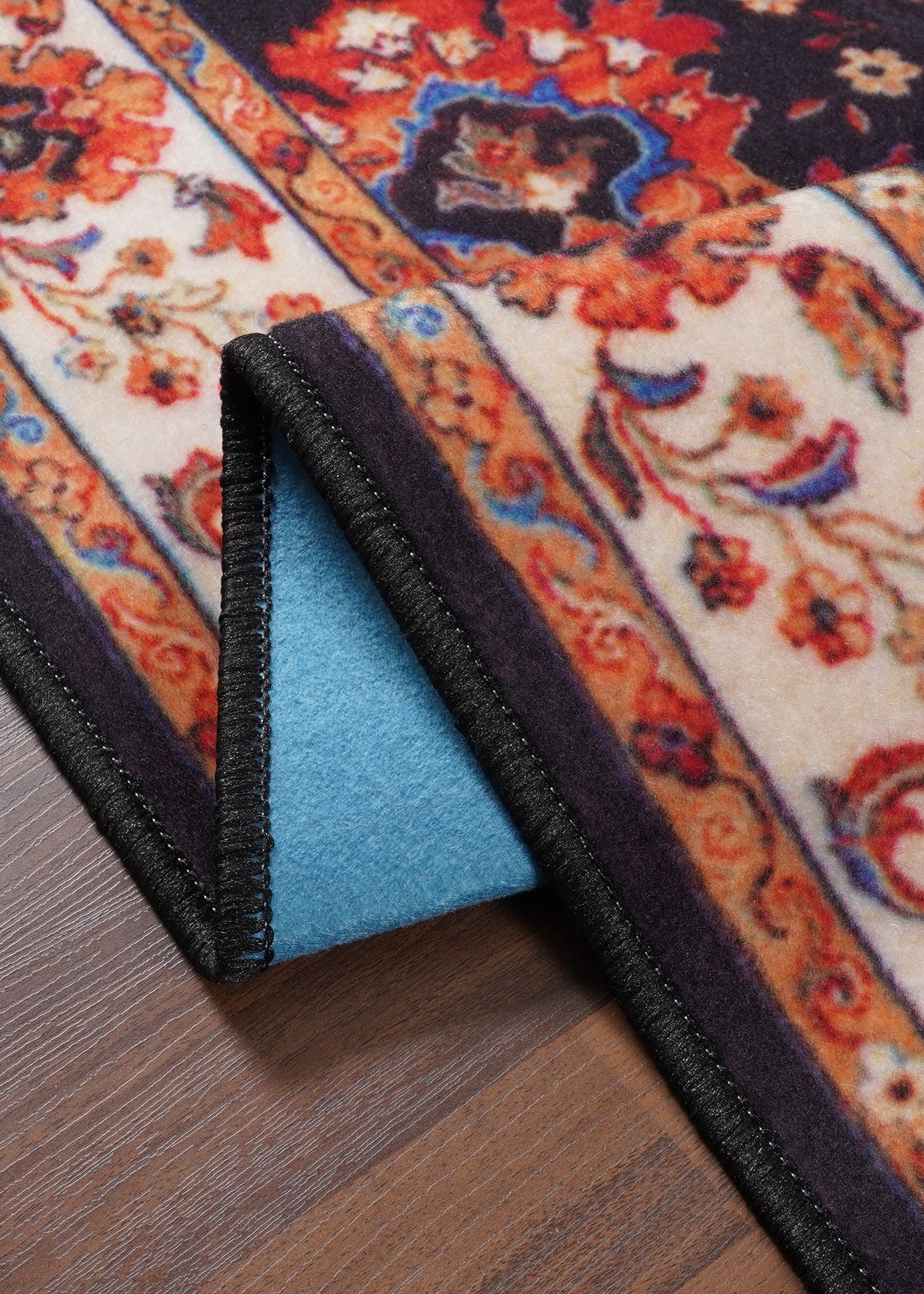 Decorative rug with floral patterns on a wooden floor